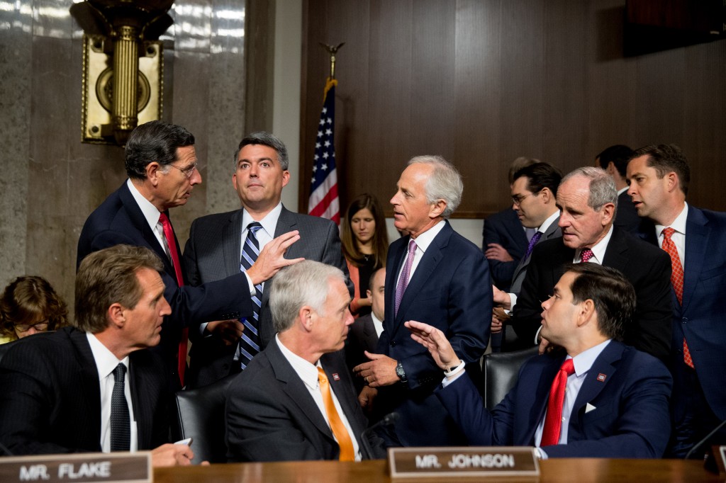 Clockwise from top left, Sen. John Barrasso, R-Wyo., Sen. Cory Gardner, R-Colo., Chairman Sen. Bob Corker, R-Tenn., Sen. James Risch, R-Idaho, Sen. Jeff Flake, R-Ariz., Sen. Ron Johnson, R-Wisc., and Republican presidential candidate, Sen. Marco Rubio, R-Fla., speak together before Secretary of State John Kerry, Secretary of Energy Ernest Moniz, and Secretary of Treasury Jack Lew, arrive to testify at a Senate Foreign Relations Committee hearing on Capitol Hill, in Washington, Thursday, July 23, 2015, to review the Iran nuclear agreement. (AP Photo/Andrew Harnik)