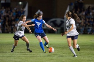 Michele Murphy Vasconcelos passes the ball  in the game against Utah state University. Murphy Vasconcelos earned the WCC player of the week award due to her double-assists against Long Beach State on Saturday. (Ari Davis)