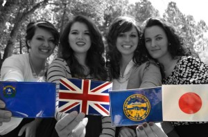 BYU student Kaitlin Cook, left, poses friends as they hold up mission flags. (Kaitlin Cook)