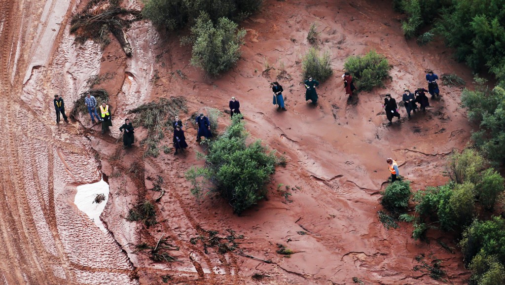 In this aerial photo searchers continue looking for 6-year-old Tyson Lucas Black in Zion National Park, Utah, Wednesday, Sept. 16, 2015. Multiple hikers who entered a narrow desert canyon for a day of canyoneering became trapped when a flash flood filled the chasm with water, killing several of them in Zion National Park in southern Utah, officials said Wednesday. (Scott G Winterton/The Deseret News via AP) SALT LAKE TRIBUNE OUT; MAGS OUT; NO SALES; MANDATORY CREDIT