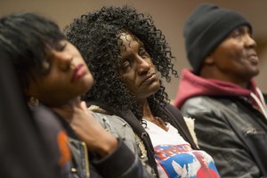 FILE - In this April 27, 2015, file photo, family members of Freddie Gray, sister Fredricka Gray, left, mother Gloria Darden, center, and stepfather Richard Shipley listen during a news conference after a day of unrest following the funeral of Freddie Gray in Baltimore. Gray's parents reached a tentative $6.4 million settlement with the city of Baltimore. The deal, announced Tuesday, Sept. 8, 2015, appeared to be among the largest settlements in police death cases in recent years and happened just days before a judge is set to decide whether to move a trial for six officers charged in Gray's death. (AP Photo/Evan Vucci, File)