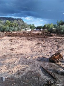 Debris and water cover the ground after a flash flood Monday, Sept. 14, 2015, in Hildale, Utah.  (Mark Lamont via AP) 