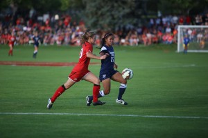 BYU's Elena Medeiros takes the ball from a Utah player at a game earlier this season. The BYU women's soccer team won their sixth game of the season on Sept. 10 against Utah State. (Ari Davis)
