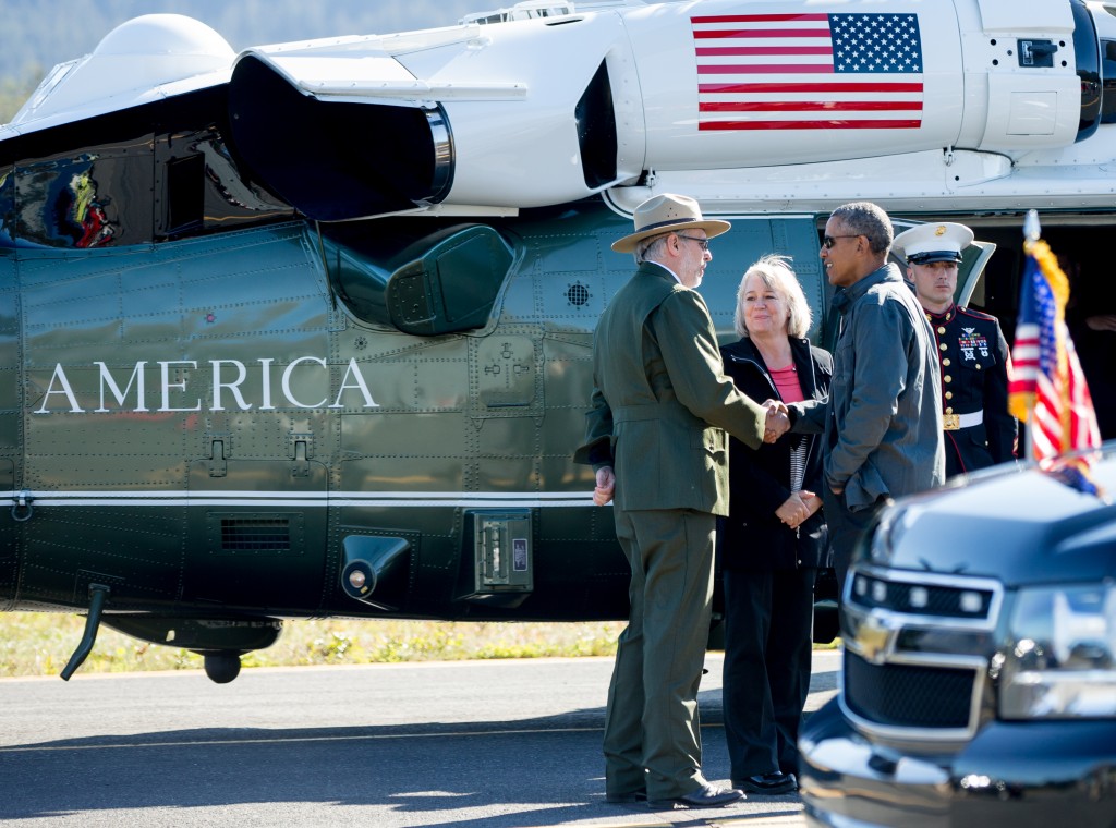 President Barack Obama is greeted by Seward Mayor Jean Bardarson and Alaska National Park Service Regional Director Bert Frost as he arrives at Seward Airport to take a hike to view the Exit Glacier, Tuesday, Sept. 1, 2015, in Seward, Alaska. Obama is on a historic three-day trip to Alaska aimed at showing solidarity with a state often overlooked by Washington, while using its glorious but changing landscape as an urgent call to action on climate change. (AP Photo/Andrew Harnik)
