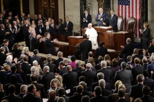 House and Senate members applause on Capitol Hill in Washington, Thursday, Sept. 24, 2015, as Pope Francis begins his addresses before a joint meeting of Congress, making history as the first pontiff to do so. (AP Photo/Pablo Martinez Monsivais)
