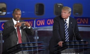 Republican presidential candidate, retired neurosurgeon Ben Carson, left, speaks as Donald Trump looks on during the CNN Republican presidential debate at the Ronald Reagan Presidential Library and Museum on Wednesday, Sept. 16, 2015, in Simi Valley, Calif. (Associated Press)
