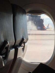 An engine on the British Airways plane caught fire before takeoff, forcing passengers to escape on emergency slides at McCarren International Airport, Tuesday, Sept. 8, 2015, in Las Vegas. (David Somers via AP) 