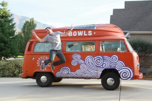 Paul Garfield being his usual happy, upbeat self jumps in front of the Happy Bowls Bus. (Morgan Allred)