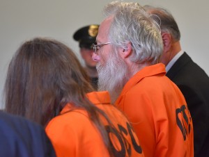 Bruce Leornard, left, and Deborah Leonard, center, stand in the courtroom during their arraignment, Tuesday, Oct. 13, 2015, in New Hartford, N.Y. The central New York couple have been charged with fatally beating their 19-year-old son inside a church, and four fellow church members have been charged with assault in an attack that also left the young man's brother severely injured, police said Tuesday. (Mark DiOrio/Observer-Dispatch via AP) ROME OUT; MANDATORY CREDIT