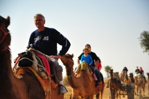 Dr. William K. Jackson rides a camel while wearing a BYU Cougars sweatshirt. (Ann Jackson)