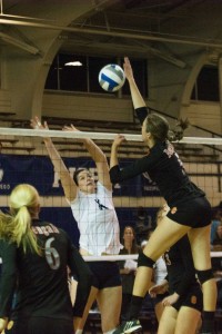 Amy Boswel attempts to block a kill against ISU earlier this year. Boswell had six blocks against San Diego. (The Universe)
