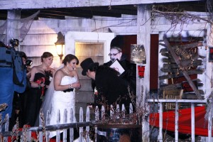 In this photo provided by Spooky World Presents Nightmare New England, Melissa Cote and Tom Cowen, who both work at Spooky World Presents Nightmare New England in Litchfield, N.H., were married the night of Monday, Oct. 26, 2015, in front of the attraction's haunted house. During the ceremony, the justice of the peace encouraged them to "haunt and howl at the moon together as long as you shall live," and "to have and to hold from this night on, in madness and in haunting fun." (Spooky World Presents Nightmare New England via AP)
