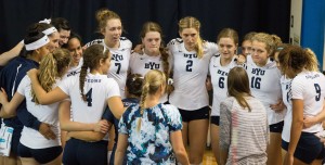 The Cougars huddle together during timeout. The Cougars lost against LMU 3-2 on Oct. 24. (Maddi Driggs)