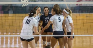 The BYU women's volleyball team huddles after a point. The Cougars defeated the Pepperdine Waves in 3-0. (Maddi Driggs)