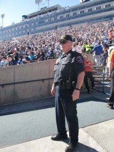 Sargent Pierce watchs for anything abnormal among the fans in the North Stadium. (Photo By: Stacie Faulk)