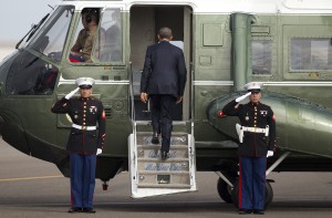 President Barack Obama boards Marine One for the short flight to Roseburg, Ore. following his arrival on Air Force One in Eugene, Ore., Friday, Oct. 9, 2015. Obama is traveling to Roseburg, Ore., to meet with families of the victims of the Oct. 1, shooting at Umpqua Community College, as part of a four-day West Coast tour. Obama is also scheduled to attend a fundraiser event later today in Seattle with Sen. Patty Murray, D-Wash. He's is also attending fundraisers in San Francisco and Los Angeles during the four-day visit. (AP Photo/Pablo Martinez Monsivais)
