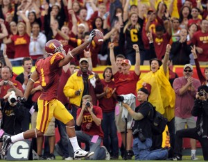 FILE - In this Saturday, Nov. 1, 2008 file photo, Southern California wide receiver Patrick Turner scores a touchdown during the first half of an NCAA college football game against Washington in Los Angeles. USC won 56-0. In 2010, researchers published a study suggesting that in the county that the football team is from, a win within 10 days before Election Day gave a small ballot-box boost to the party of the incumbent senator, governor or president. But a new analysis published on Monday, Oct. 26, 2015 concludes the original result was just a statistical fluke. (AP Photo/Mark J. Terrill, File)