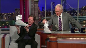 Michael J. Fox explains Nike's self-lacing shoes on the Late Show with David Letterman. Fox said 1,500 pairs of the shoes were auctioned on eBay, with donations matched for Parkinson's disease research. (YouTube). 