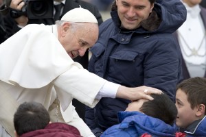 Pope Francis blesses sick children during his weekly general audience, in St. Peter's Square, at the Vatican, Wednesday, Oct. 21, 2015. The Vatican is denying a report in an Italian newspaper that Pope Francis has a small, curable brain tumor. The Vatican spokesman, the Rev. Federico Lombardi, said the report Wednesday in the National Daily was "unfounded and seriously irresponsible and not worthy of attention." (AP Photo/Andrew Medichini)