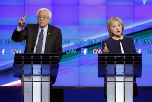 Hillary Rodham Clinton, right, and Sen. Bernie Sanders, of Vermont, speak during the CNN Democratic presidential debate Tuesday, Oct. 13, 2015, in Las Vegas. (Associated Press)
