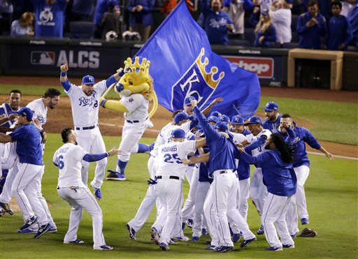 Kansas City Royals celebrates their 4-3 win against the Toronto Blue Jays in Game 6 of baseball's American League Championship Series on Friday, Oct. 23, 2015, in Kansas City, Mo. (AP Photo/Jae C. Hong)
