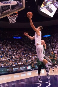 Kyle Collinsworth gets some air against Adams State. Collinsworth now owns the NCAA's single season and career triple-doubles record. (Nathalie Bothwell)