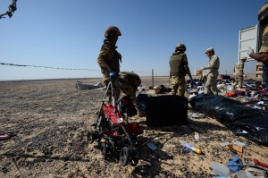 In this Russian Emergency Situations Ministry photo, made available on Monday, Nov. 2, 2015 Egyptian soldiers collect personal belongings of plane crash victims at the crash site of a passenger plane bound for St. Petersburg in Russia that crashed in Hassana, Egypt's Sinai Peninsula, on Monday, Nov. 2, 2015. A Russian cargo plane on Monday brought the first bodies of Russian victims home to St. Petersburg, from Egypt. Photo: Associated press