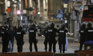 Police forces prepare in St. Denis, a northern suburb of Paris, Wednesday, Nov. 18, 2015. Authorities in the Paris suburb of St. Denis are telling residents to stay inside during a large police operation near France's national stadium that two officials say is linked to last week's deadly attacks. (AP Photo/Christophe Ena)