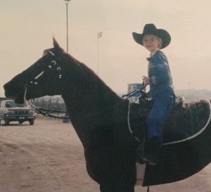 Hunt poses on her horse after competing in a Western horse show class as a young girl. When things get tough on the field, even now, Hunt turns to riding horses to find solace. (Photo provided by Paige Hunt)
