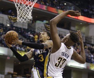 Utah Jazz's Trey Burke shoots against Indiana Pacers' Myles Turner during the second half of the game.  The Jazz beat the Pacers 97-76. (AP Photo/Darron Cummings)