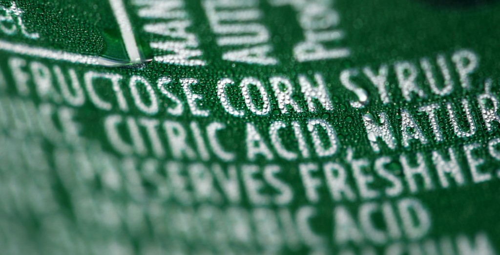 This Sept. 15, 2011 file photo shows a nutrition label that lists high fructose corn syrup as an ingredient in a can of soda, in Philadelphia. In a trial starting Tuesday, Nov. 3, 2015, jurors in the case between sugar processors and corn manufacturers will take up one of nutrition’s most vexing debates and confront a choice common among some consumers: sugar or high fructose corn syrup? (Associated Press)