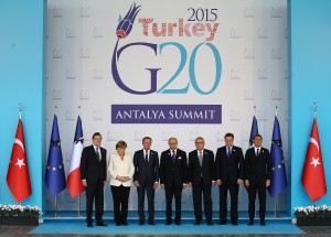 European Union leaders observe a minute of silence to honour the victims of the attacks in Paris, at the G-20 Summit in Antalya, Turkey, Monday, Nov. 16, 2015. From left to right, Spain's Prime Minister Mariano Rajoy, German Chancellor Angela Merkel, European Council President Donald Tusk, France's Foreign Minister Laurent Fabius, European Commission President Jean-Claude Juncker, British Prime Minister David Cameron, and Italian Prime Minister Matteo Renzi. The leaders of the Group of 20 were wrapping up their two-day summit in Turkey Monday against the backdrop of heavy French bombardment of the Islamic State's stronghold in Syria. (Anadolu Agency via AP, Pool)