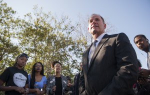 In a Tuesday, Nov. 3, 2015 photo, University of Missouri President Tim Wolfe speaks with members of Concerned Student 1950 senior Abigail Hollis, from left, senior DeShaunya Ware and junior Shelbey Parnell as they call for Wolfe's resignation outside University Hall on the University of Missouri campus, in Columbia, Mo. Wolfe resigned Monday, Nov. 9, 2015, amid criticism of handling of racial issues. (Daniel Brenner/Columbia Daily Tribune via AP)