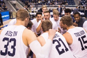 The BYU men's basketball team huddles before playing Arizona Christian. The Cougars have high expectations for the 2015-2016 season. (Ari Davis)