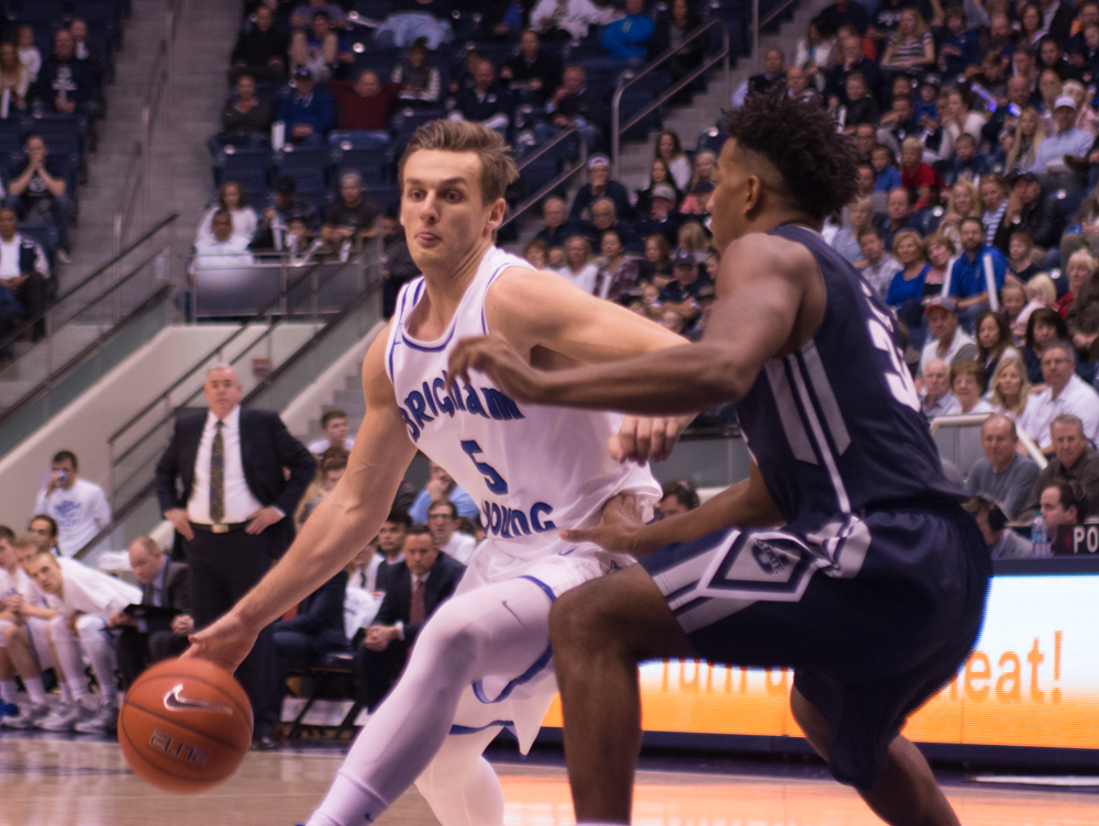 Kyle Collinsworth drives to the hoop against Utah State. Collinsworth continues to lead the Cougars on and off the court. (Natalie Bothwell)
