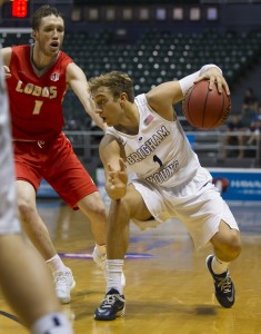 New Mexico guard Cullen Neal (1) looks on as BYU guard Chase Fischer (1) dribbles in the second half of an NCAA college basketball game at the Diamond Head Classic, Wednesday, Dec. 23, 2015, in Honolulu. (AP Photo/Eugene Tanner)