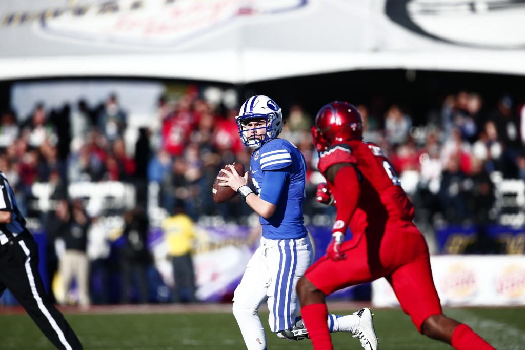 Tanner Mangum looks to throw the ball at the 2015 Las Vegas Bowl. SENTENCE ABOUT WINNING OR LOSING HERE. (BYU Photo)