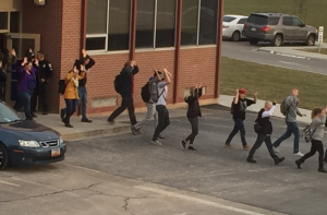 Students leave the school during the lockdown. A threat of weapons initiated the lockdown at Pleasant Grove High school. (KSL's Twitter account)