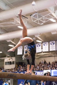 Makenzie Halliday competes on the balance beam during the meet against Boise State and UC Davis. BYU placed second on the night with a score of 195.475.