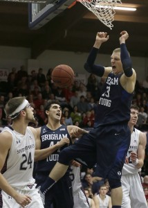 BYU forward Nate Austin, right, dunks against Saint Mary's (Calif.) during the first half of an NCAA college basketball game in Moraga, Calif., Thursday, Dec. 31, 2015. (AP Photo/Jeff Chiu)