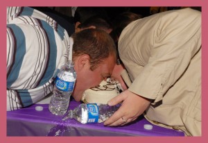 Patrons at the Bridal Fair participating in the Cake Eating contest. (The Bridal Fair) 