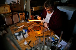 Marge Rosebrook uses an acetylene torch to melt glass into a replica of the Manti LDS Temple on Wednesday, Dec. 16, 2015 in a small workshop shed outside her home in Provo. ( AP)