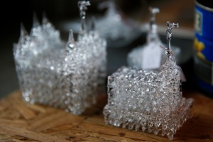 Small glass temples sit on Marge Rosebrook's work table on Wednesday, Dec. 16, 2015 in a small workshop shed outside her home in Provo. (AP)