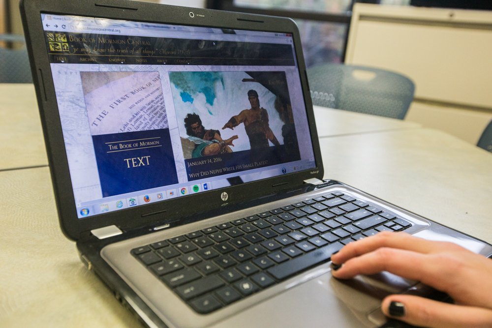 Elle Peterson, a junior at BYU, uses the new Book of Mormon website to help her complete a paper for her Book of Mormon class. (Credit: Maddi Driggs)