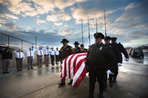 Unified Police Department officer Doug Barney's casket is carried into the arena prior to his funeral at the Maverik Center in West Valley City, Utah, Monday, Jan. 25, 2016. Barney was killed in the line of duty on Sunday, Jan. 17. (Scott G Winterton/Deseret News via AP))