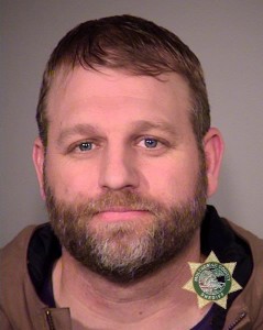 This photo provided by the Multnomah County Sheriff's Office on Wednesday, Jan. 27, 2016, shows Ammon Bundy, one of the members of an armed group occupying the Malheur National Wildlife Refuge as part of a dispute over public lands in the Western U.S. Bundy and several others were arrested on Tuesday, Jan. 26, prompting gunfire and leaving one man dead during a traffic stop along a highway in Oregon's frozen high country. (Multnomah County Sheriff via AP)