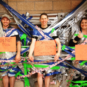 Principal Theler duct taped to the wall as a reward for the students reading program. 