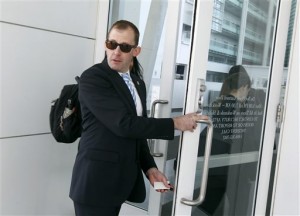 Justice department prosecutor Sean Keveney enters the Sandra Day O'Connor United States District Court where a federal civil rights trial against two polygamous towns on the Arizona-Utah border is located. (Associated Press)