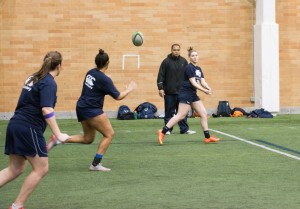 Senior Jordan Gray goes to catch the rugby ball in practice. BYU played an alumni selection in their home opener Saturday.