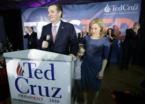 Republican presidential candidate, Sen. Ted Cruz, R-Texas, speaks at caucus night rally with Heidi, and their daughter Caroline, 7, Monday, Feb. 1, 2016, in Des Moines, Iowa. Cruz sealed a victory in the Republican Iowa caucuses, winning on the strength of his relentless campaigning and support from his party's diehard conservatives. (AP Photo/Charlie Neibergall)